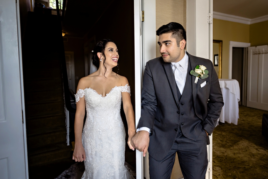 A bride and groom have a first touch before the wedding ceremony at the ryland inn in NJ.